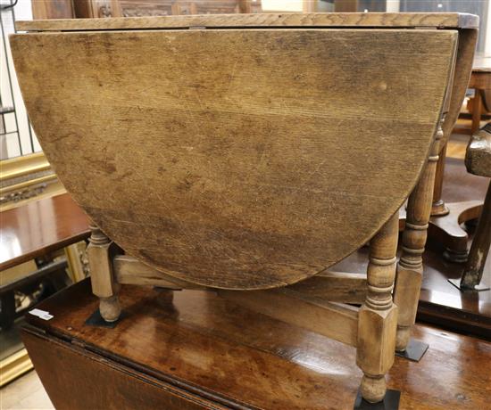 A stripped oak gateleg table, W.92cm